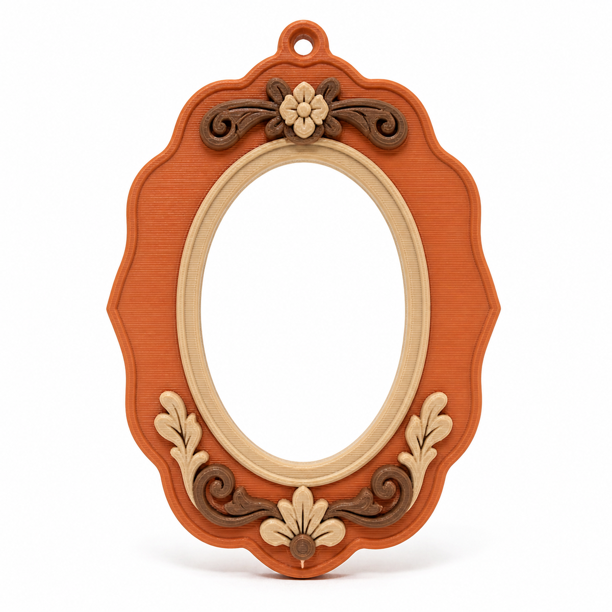 Product image of "Oval photo frame with flower ornaments" on white background: photo frame; Basic shape: high oval frame with small upper suspension eye; Design: curved outer edges and plastic flowers on top and bottom; Colours: terracotta, beige and dark brown.