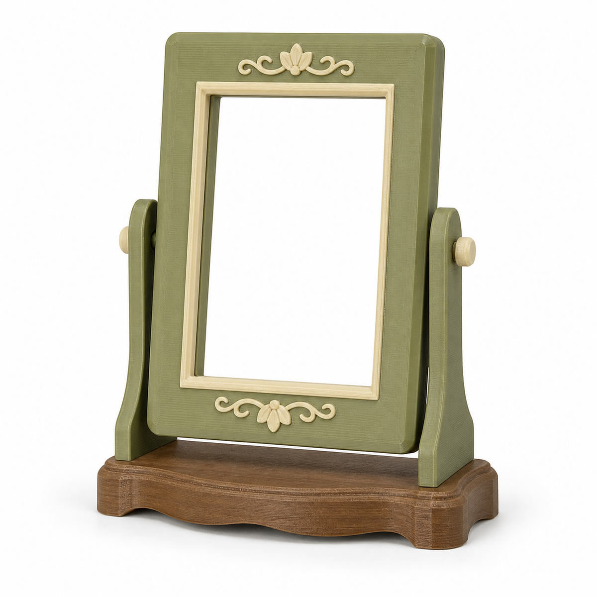 Product image of "Switchable table picture frame in sage green" on white background: Table picture frame; Basic shape: high-format rectangular frame in two side holders on stand; Design: side pivots and a wide curved base; Colours: sage green, cream and brown.