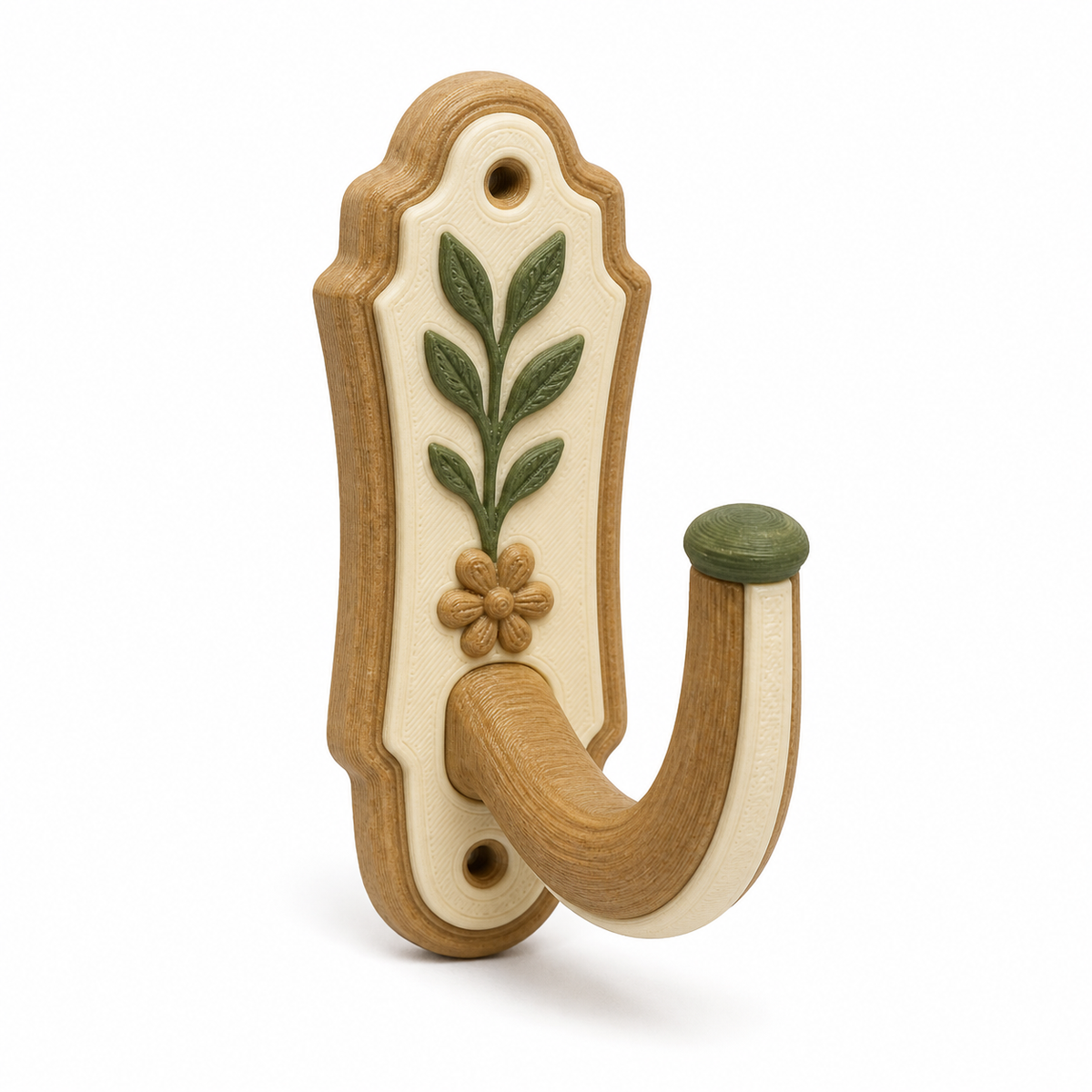 Product illustration of "curtain hook with framed leaf motif" on white background: curtain hook; Basic shape: curved wallplatte with wide open individual hook; Design: a curved rear wall and two fastening openings; Colours: natural brown, cream and dark green.