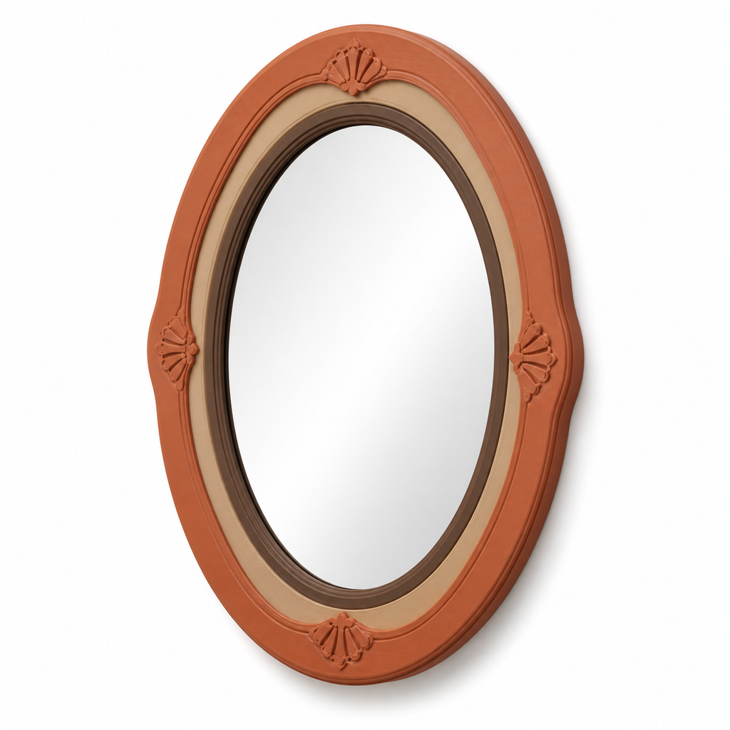 Product image of "Oval Mirror frames with leaf reliefs" on white background: Mirror frames; Basic shape: sleek high-oval shape with multiple bordered inside edge; Design: four symmetrically set small leaf reliefs on the outside frame; Colours: terracotta, beige and brown.