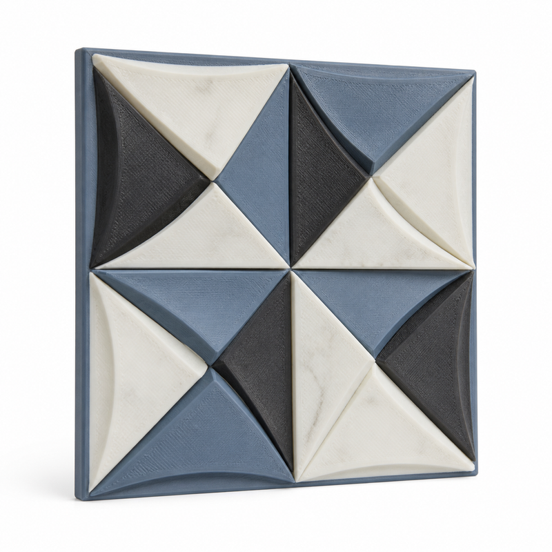 Product illustration by “Quadratic wall relief with quilt star” on white background: wall relief; Basic shape: square plate made of eight geometrically folded relief segments; Design: a symmetrical windmill-like star pattern made of concave triangles; Colours: white, grey blue and dark grey.
