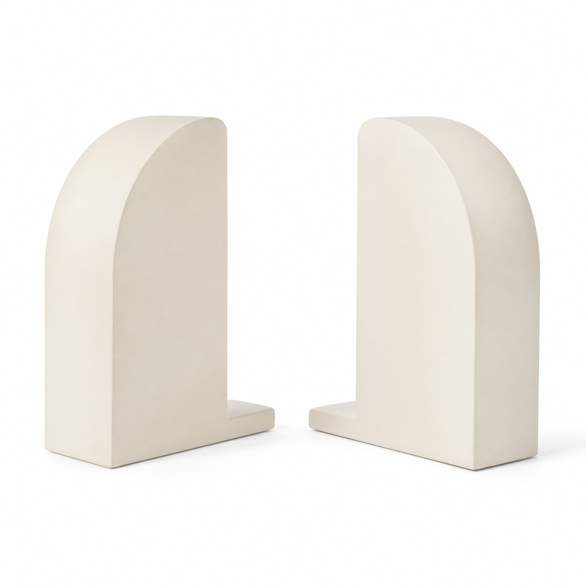 Couple of warm white book ends with high semi-circular rounded outer contours, flat insides and short bases on white background.