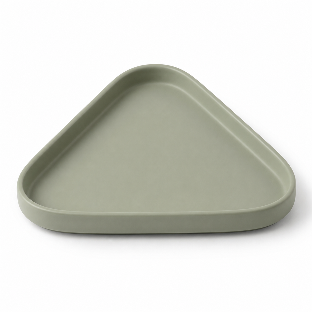 Sage green triangular decorative tray with strongly rounded tips, narrow raised edge and flat recessed center on white background.