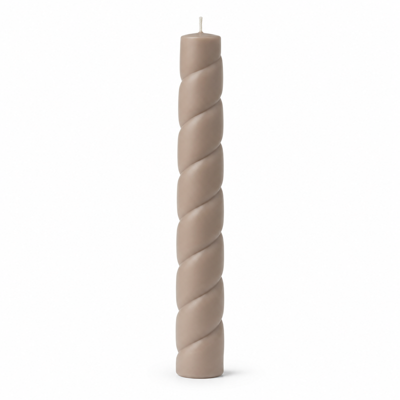 Taupe-colored spiral candle with unilluminated wick on white background