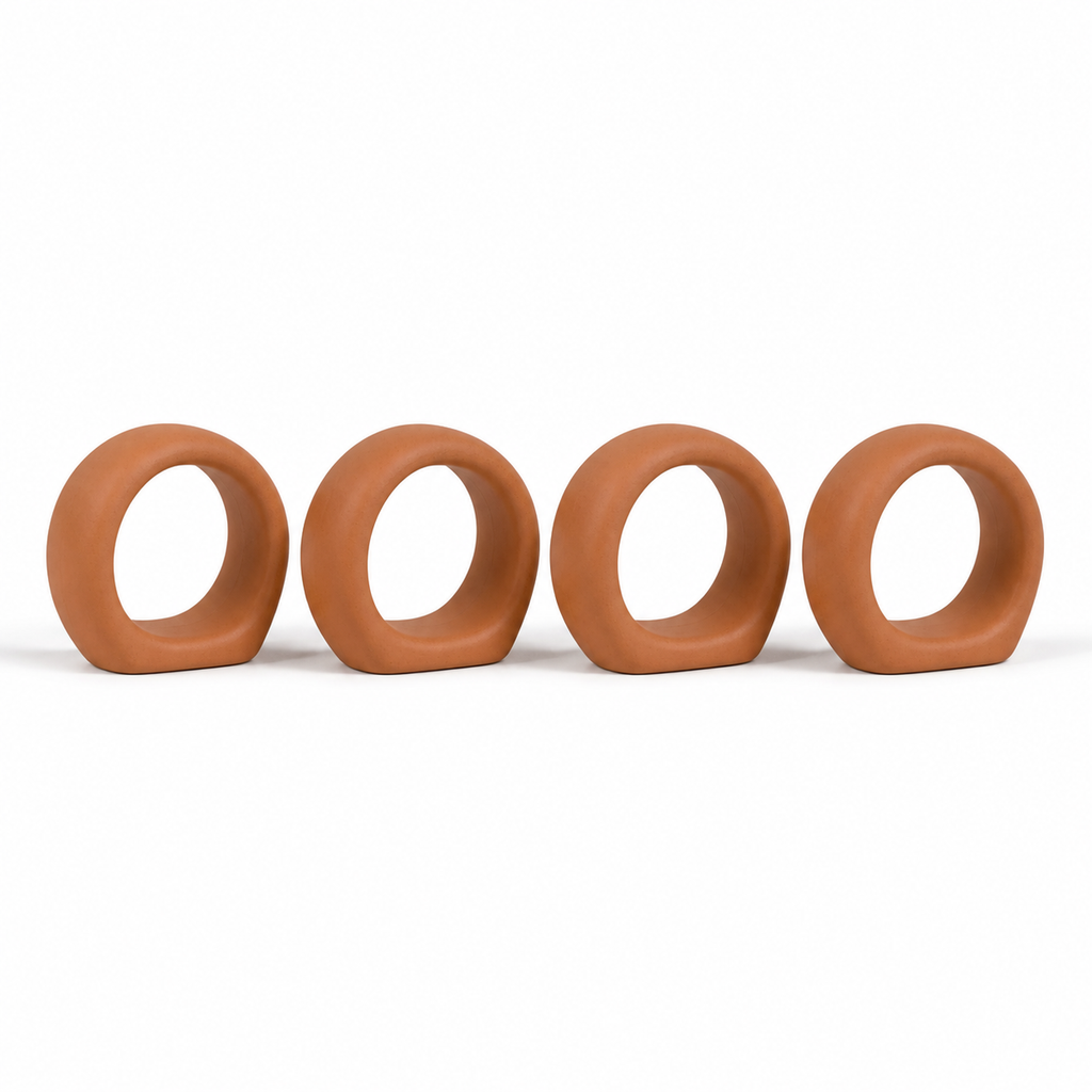 Four terracotta-coloured minimalist napkin rings as wide round loops
