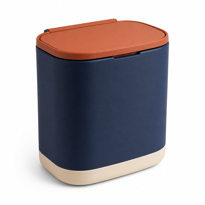 Product illustration of "Breiter waste bin in Navy and terracotta" on white background: waste bin; Basic shape: compact wide rectangular shape with flat folding lid; Design: generous smooth front surfaces and a lightly set-off base; Colours: navy blue, terracotta and cream.