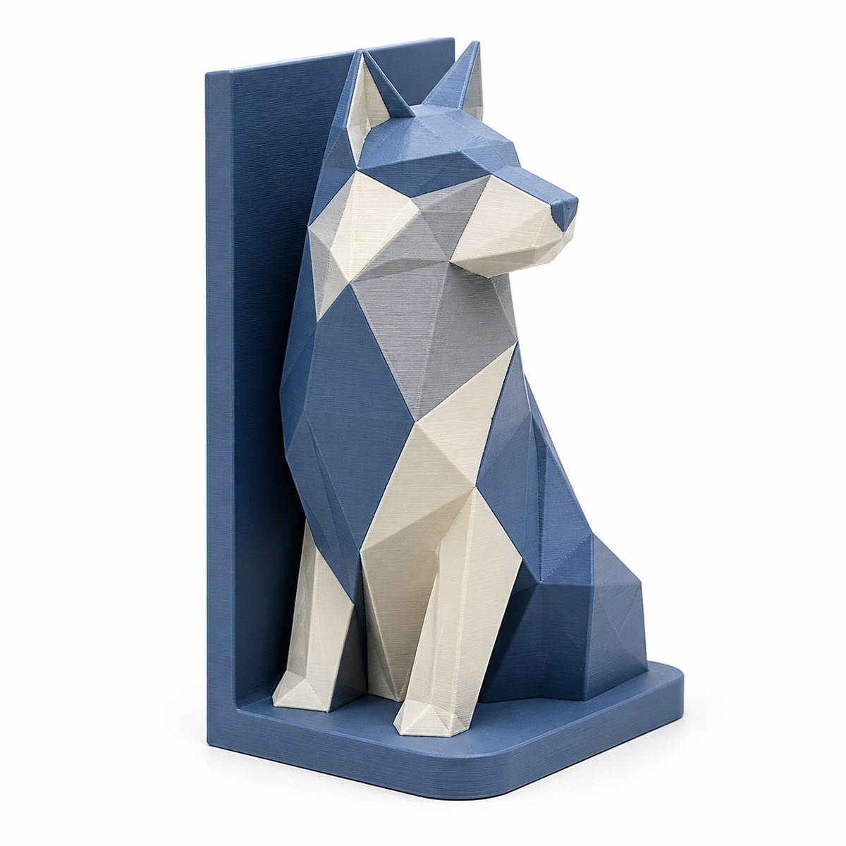 Product illustration of “bookend with faceted fox” on a white background: bookend; Basic shape: right-angled support with plastic seated fox figure; Design: edgy modeled head, chest and body surfaces in front of high back wall; Colours: blue, grey and white.