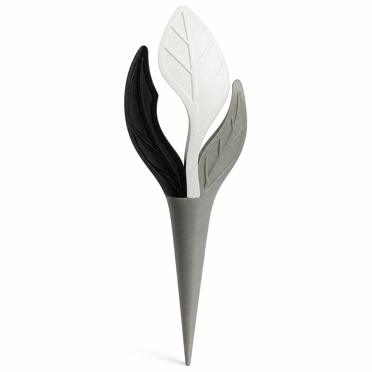 Product illustration by “garden stake with three abstract leaves” on white background: garden stake; Basic shape: slim pointed earth shape with three-piece leaf head; Design: three overlaid long-drawn leaves at different heights; Colours: white, grey and black.