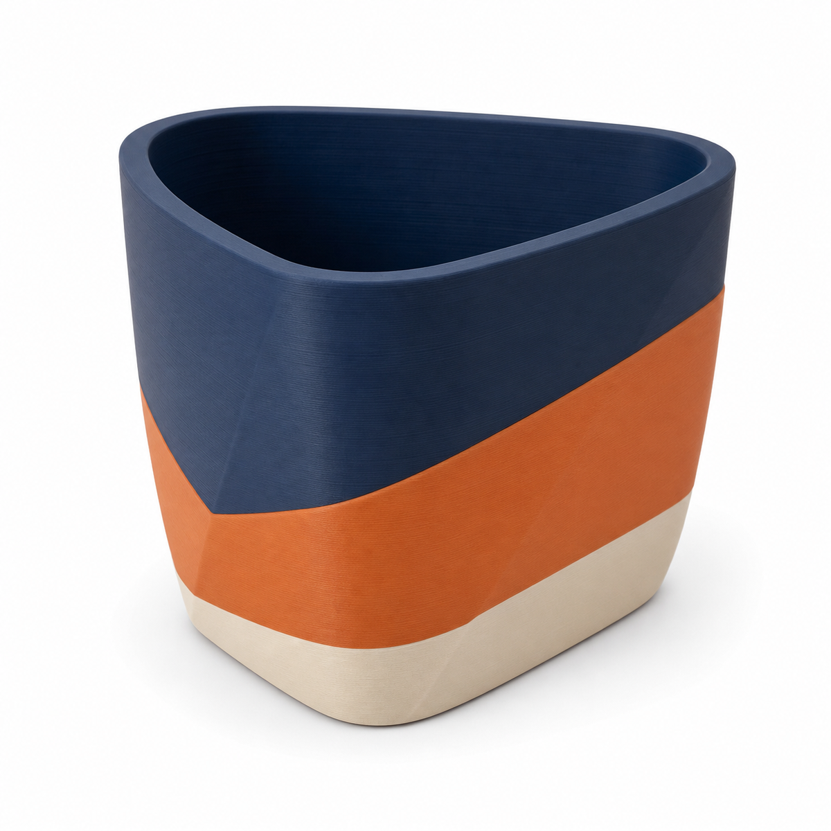 Abgerundeter Pflanztopf in Navy und Terrakotta – Produktansicht auf weißem Hintergrund; Farben: Navyblau, Terrakotta und Creme.