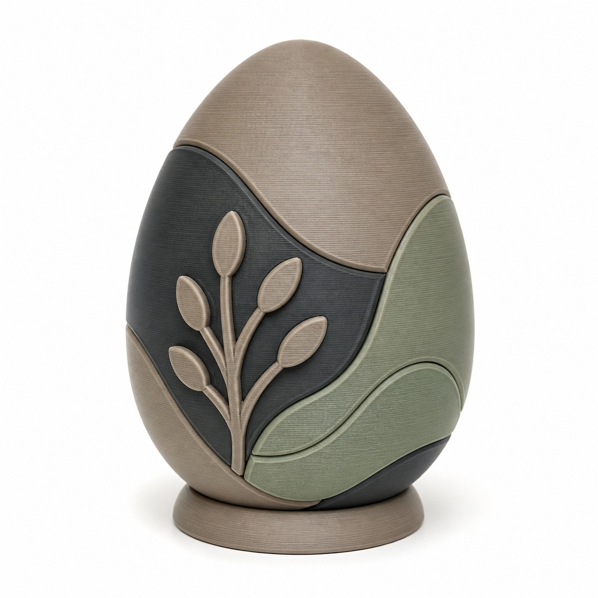 Product illustration of “Modern Easter egg with leaf branch” on white background: Easter decoration; Basic shape: upright egg shape on a flat oval base; Design: organic curved colour fields and a reduced plant relief; Colours: taupe, sage green and anthracite.