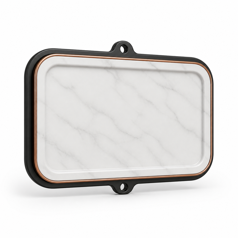 Product illustration of "Rectangular wall sign in marble look" on white background: wall sign; Basic shape: wide rounded rectangular shape with three small attachment eyelets; Design: a black outer frame and a generous marble interior; Colours: marble white, black and copper.