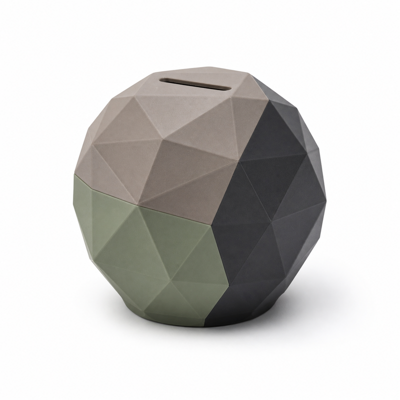 Product image of "Spherical money box in taupe and sage" on white background: money box; Basic shape: round highly faceted spherical shape with upper insertion slot; Design: numerous polygonal surfaces of different sizes and a flattened stand; Colours: taupe, sage green and anthracite.