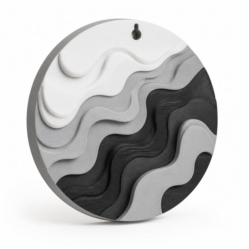 Product image of "round wall relief mit abstrakten Wellen" on a white background: wall relief; Basic shape: round reliefplatte with small upper suspension opening; Design: several organically layered wavebands at different heights; Colours: white, grey and black.