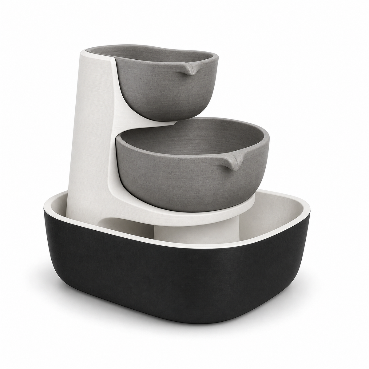 Product illustration by “Minimalistic indoor fountains with two bowls” on a white background: Indoor fountains; Basic shape: two-stage grey shell cascade in front of a white back in a large basin; Design: two rounded outlet bowls and a wide black collecting bowl; Colours: white, grey and black.