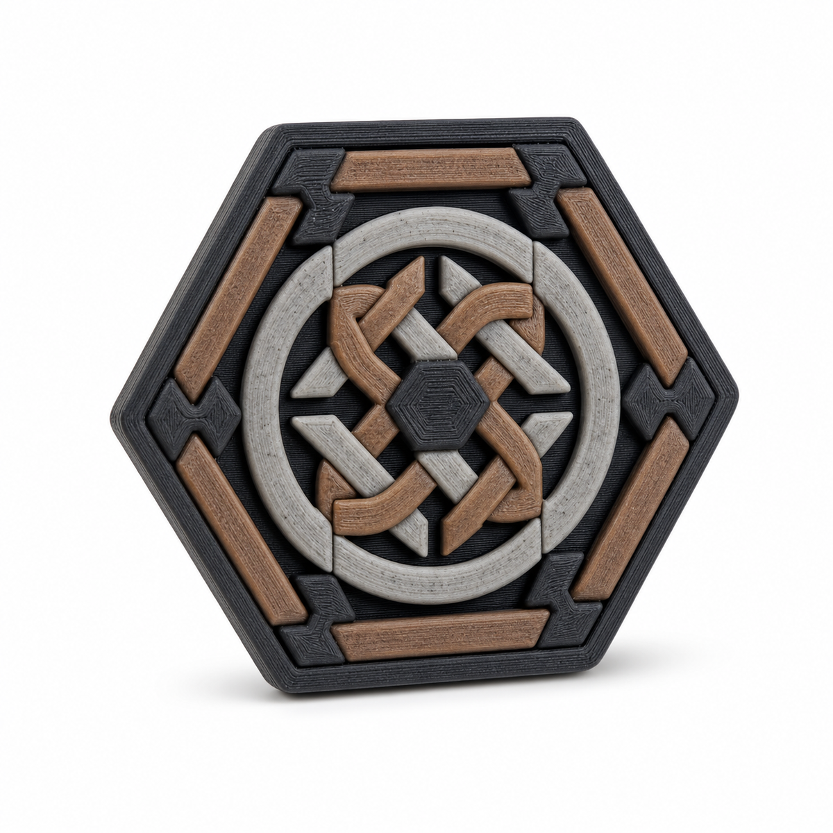 Sechseckiger Magnet mit Rundknoten – Produktansicht auf weißem Hintergrund; Farben: Braun, Silbergrau und Schwarz.