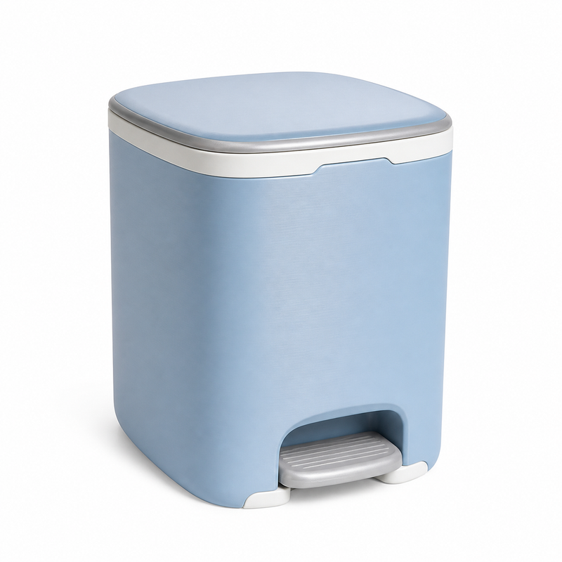 Product image of "Pedal-waste bin in soft sky blue" on white background: waste bin; Basic shape: compact rounded rectangular shape with flat light blue lid; Design: an unobtrusive front pedal and a narrow white edge line; Colours: sky blue, white and silver grey.