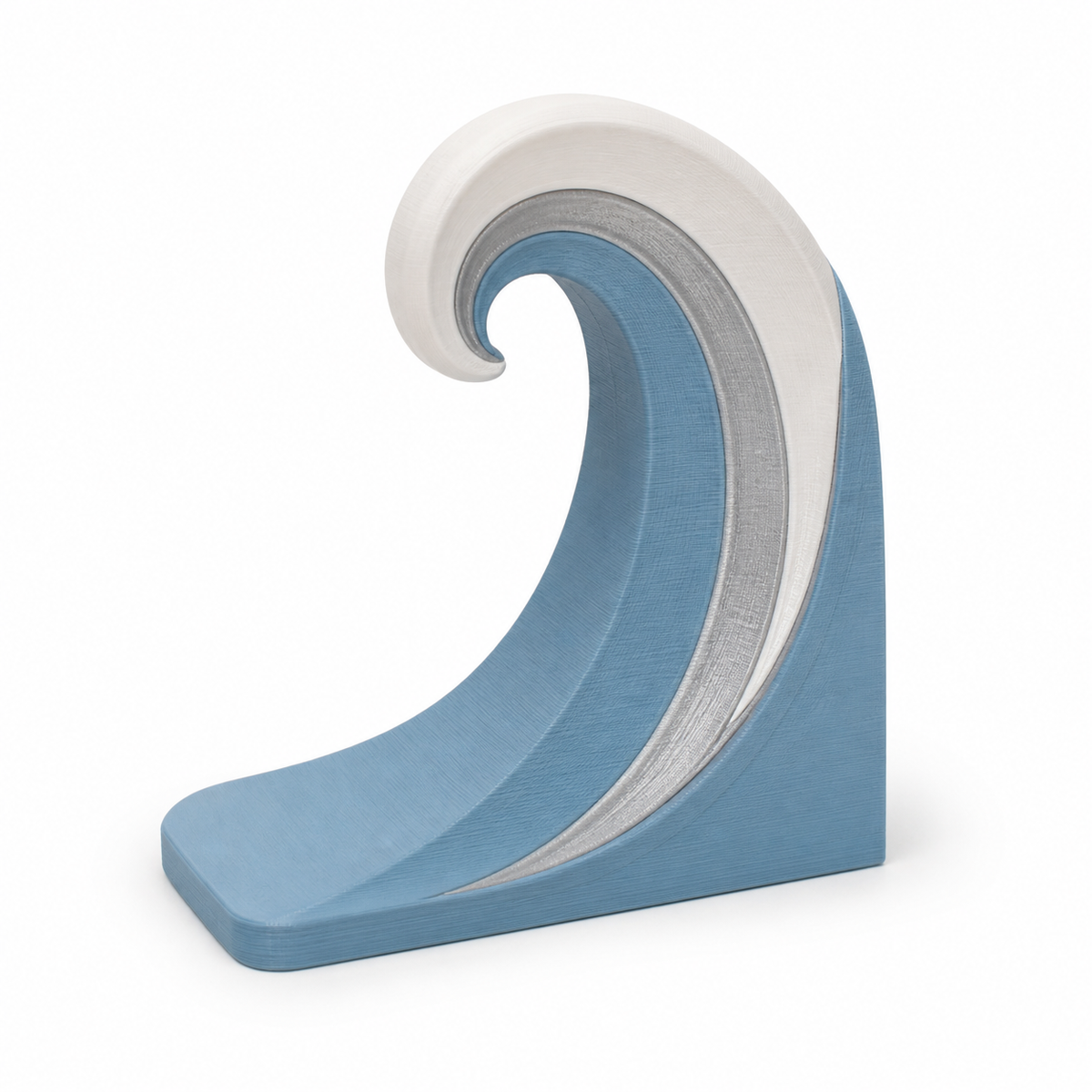 Product illustration of "bookend with large calm wave" on a white background: bookend; Basic shape: right-angled support with high-up rolled wave front; Design: three concentric curved waves; Colours: sky blue, white and silver grey.