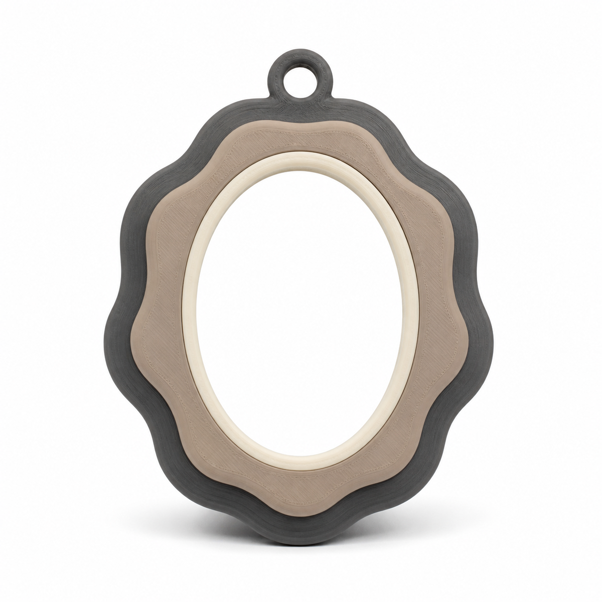 Product image of "Oval photo frame with corrugated edge" on white background: photo frame; Basic shape: high-oval frame with small upper suspension loop; Design: several softly curved concentric edge bands; Colours: anthracite, taupe and cream.