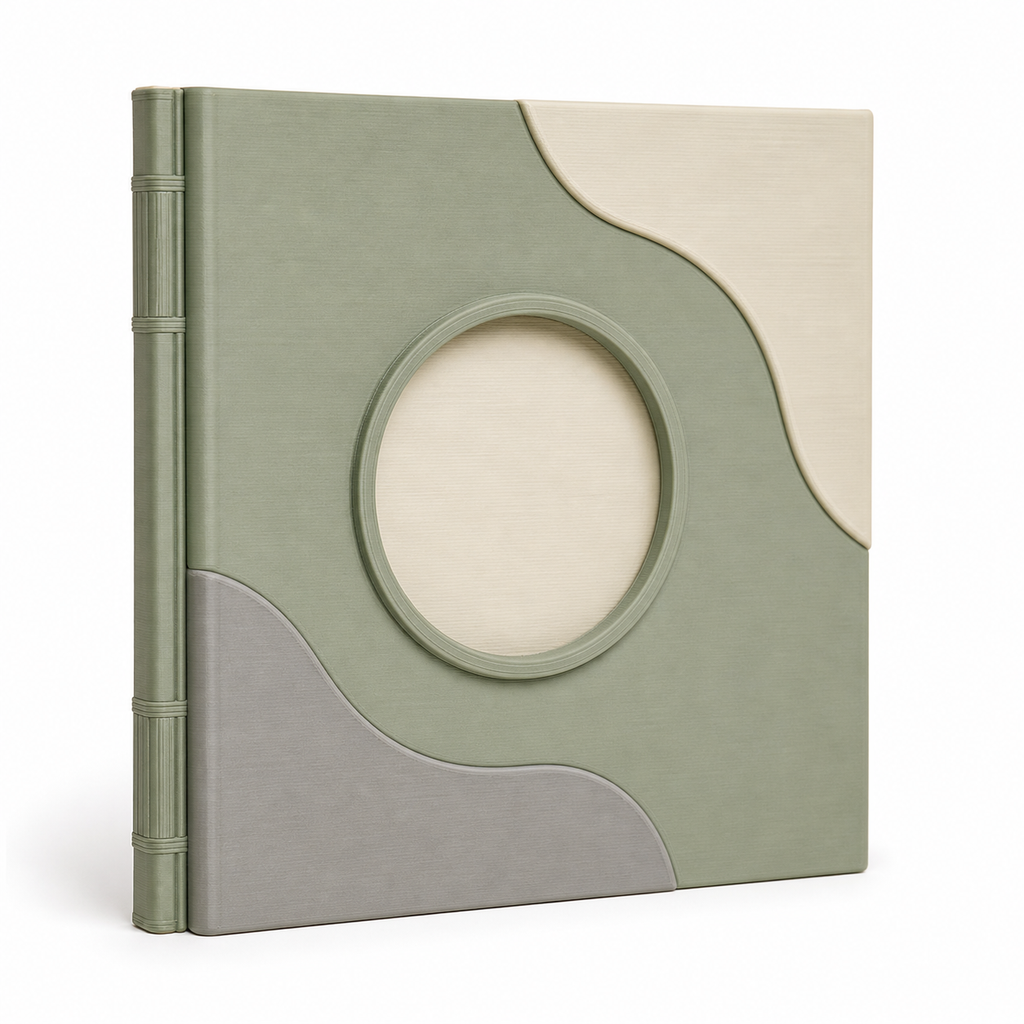 Product image of "photo album with round picture window and wave fields" on white background: photo album; Basic shape: high-format book-like album with salbei green back; Design: a large oval picture window and organically layered cover surfaces; Colours: sage green, cream and light grey.