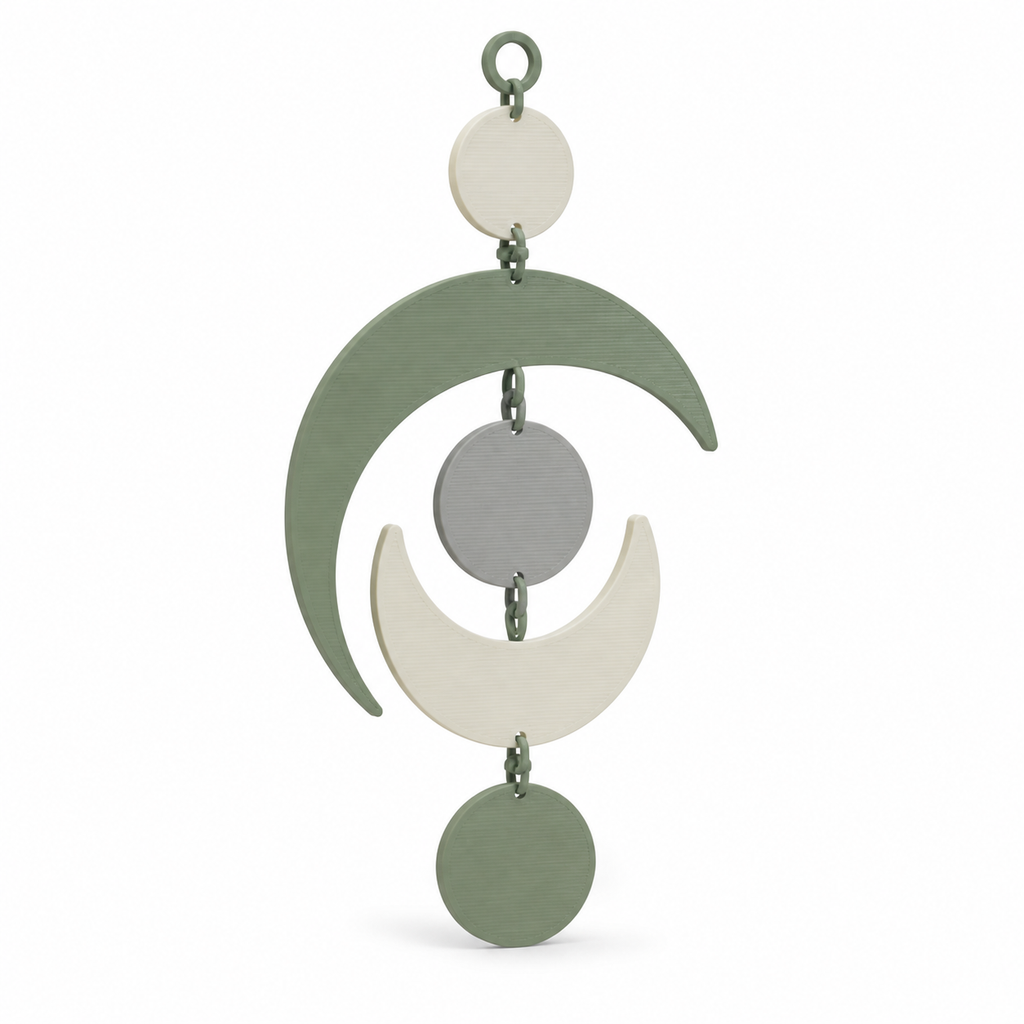 Product illustration of “hanging decoration with quiet phases of the moon” on a white background: hanging decoration; Basic shape: vertical sequence of circles and large crescents; Design: several freely connected celestial forms in gentle balance; Colours: sage green, cream and light grey.