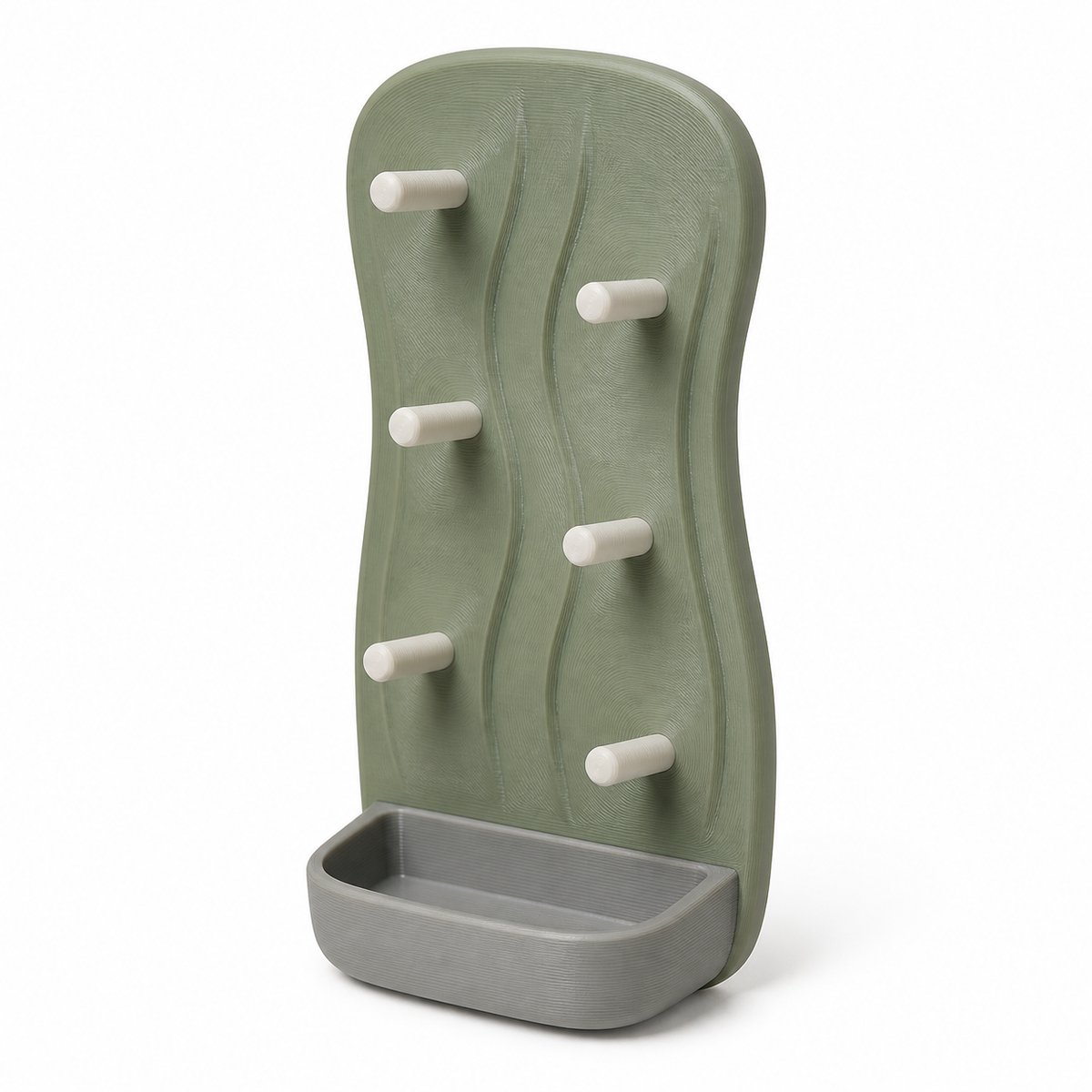 Product illustration of “Vertical key rack with six pins” on a white background: key rack; Basic shape: high organically curved rear wall with six offset pins and foot shell; Design: a soft relief curve and a compact light grey collecting tray; Colours: sage green, cream and light grey.