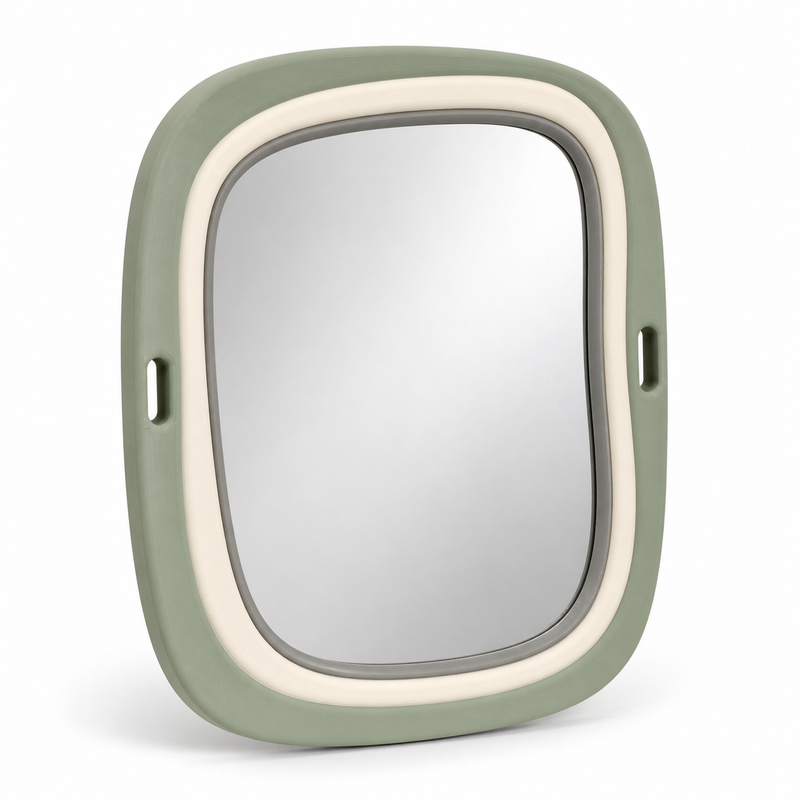 Product image of "Runded Mirror frames in sage green" on white background: Mirror frames; Basic shape: high-format rectangular shape with strongly rounded corners; Design: a wide sage green outer frame and two small lateral openings; Colours: sage green, cream and light grey.