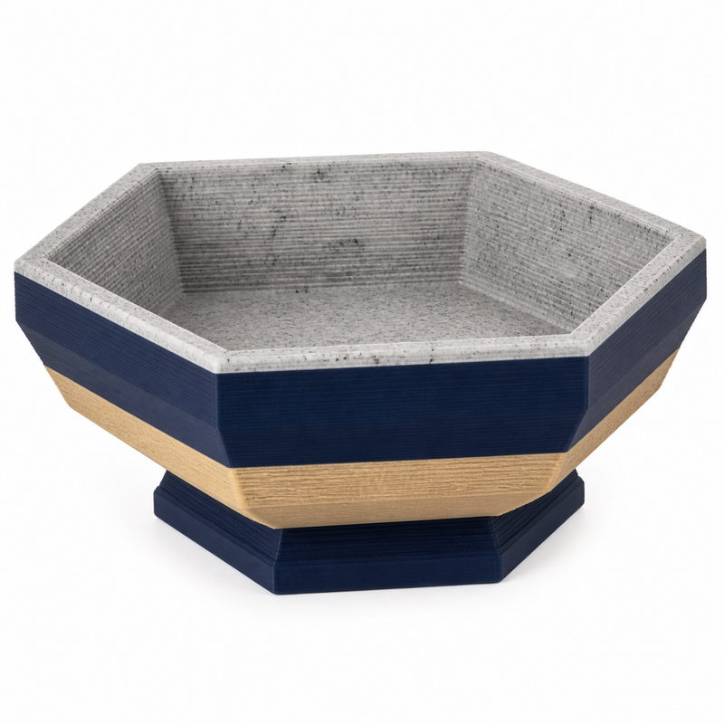 Sechseckige Fußschale in Navy und Steingrau – Produktansicht auf weißem Hintergrund; Farben: Navyblau, Steingrau und Beige.