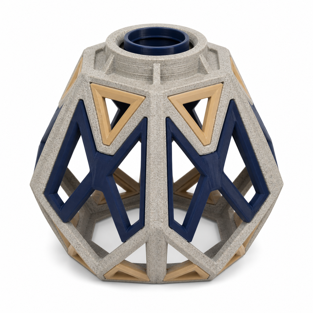 Product illustration of "Polygonal lampshade in Navy and stone grey" on white background: lampshade; Basic shape: bulbous faceted dome shape with round upper opening; Design: large perforated navy blue angular struts and bright triangular fields; Colours: navy blue, stone grey and beige.