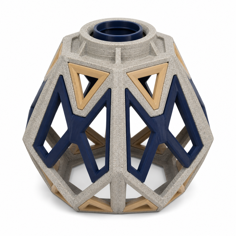 Product illustration of "Polygonal lampshade in Navy and stone grey" on white background: lampshade; Basic shape: bulbous faceted dome shape with round upper opening; Design: large perforated navy blue angular struts and bright triangular fields; Colours: navy blue, stone grey and beige.