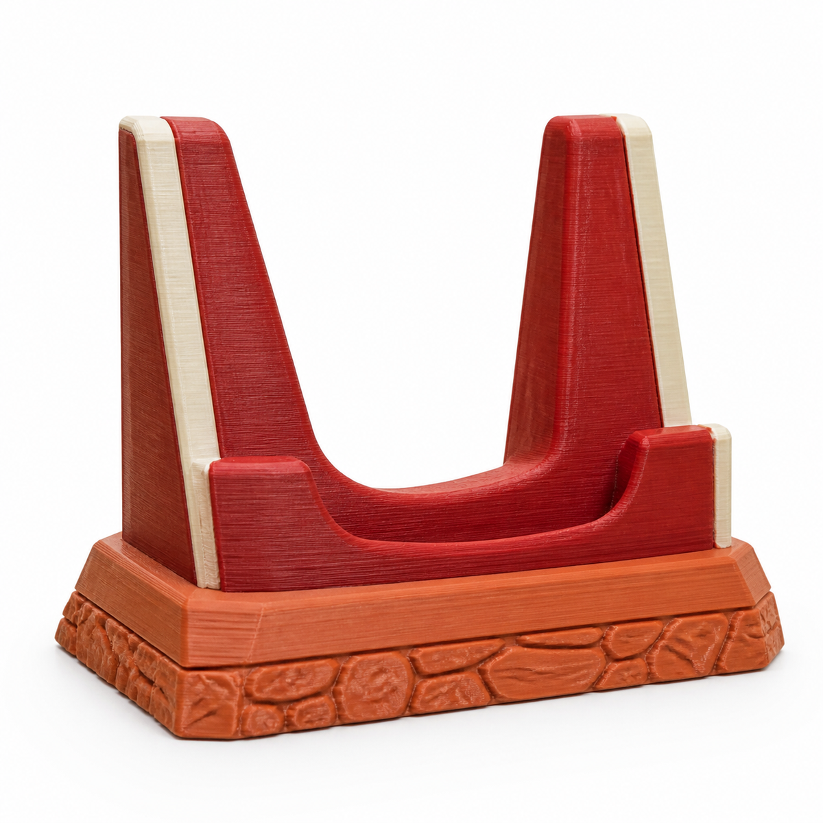 Product illustration of "U-shaped Display stands in terracotta" on white background: Display stands; Basic shape: wide U-shaped pad with two high red side supports; Design: a creamy interior contour and a reliefed terracotta base frieze; Colours: terracotta, red and cream.