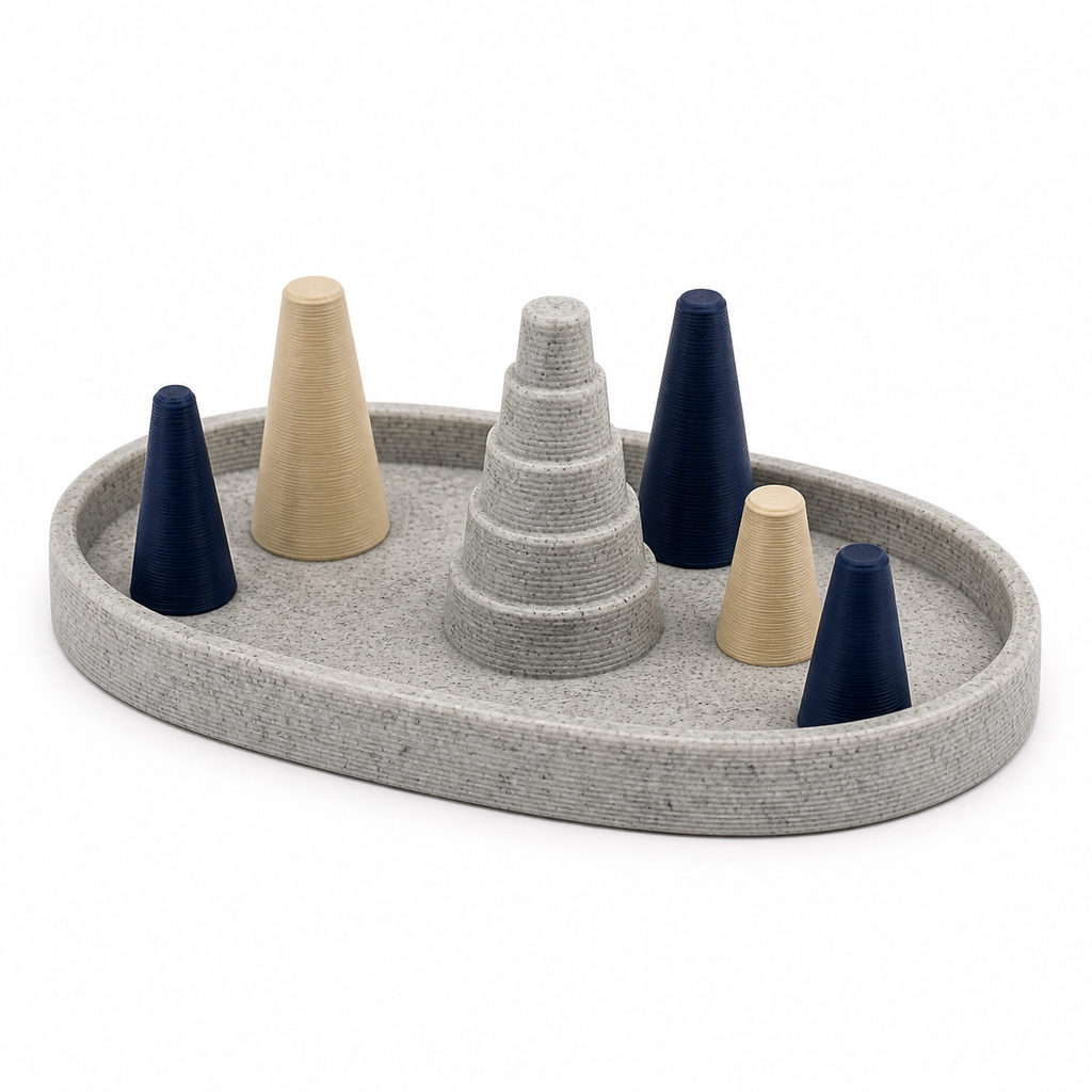 Ringtablett Bergkiesel – Produktansicht auf weißem Hintergrund; Farben: Steingrau, Dunkelblau und Creme.