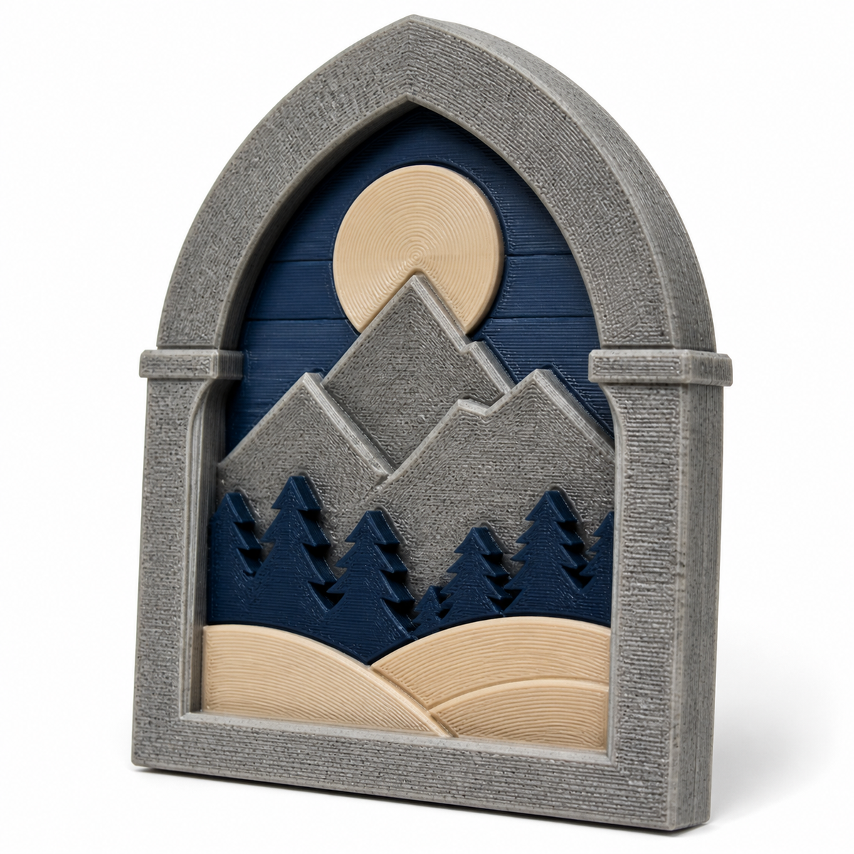 Product illustration of "Window Relief Nordmond" on a white background: wall relief; Basic shape: high-format circular arc board in a strong stone-like frame; Design: layered mountain, forest and moon landscape; Colours: stone grey, dark blue and beige.