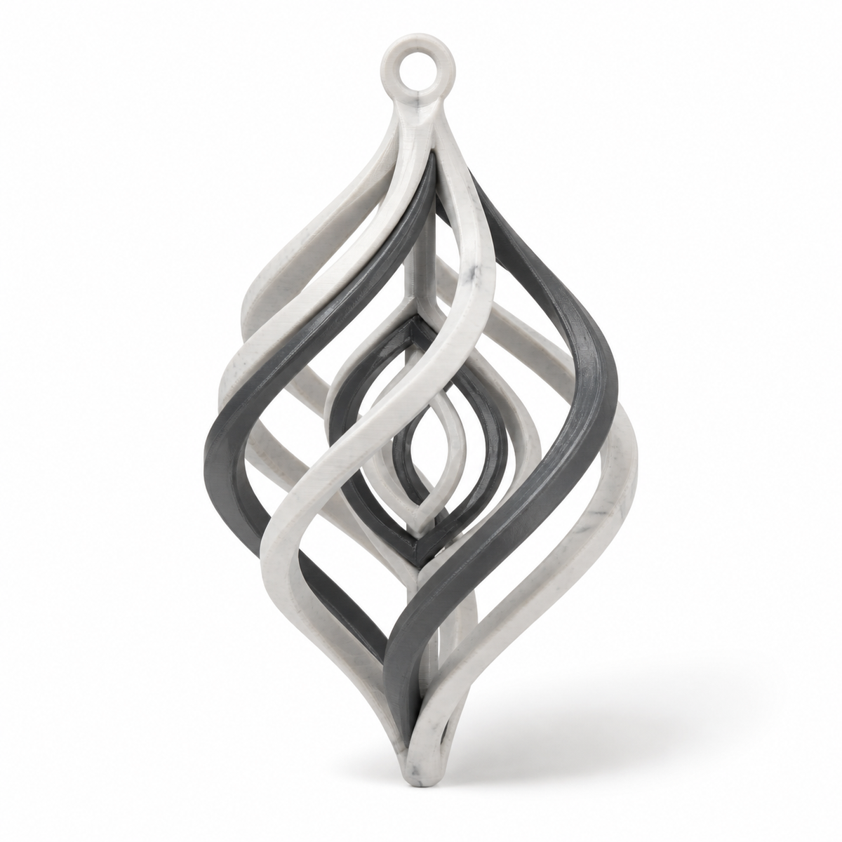 Product illustration of "Hanging Ornament Marmoroptik-flamme" on white background: hanging decorationration; Basic shape: long stretched drop shape with upper suspension eye; Design: multiple interlocking curved ribbons create an open flame silhouette; Colours: marble white, dark grey and black.