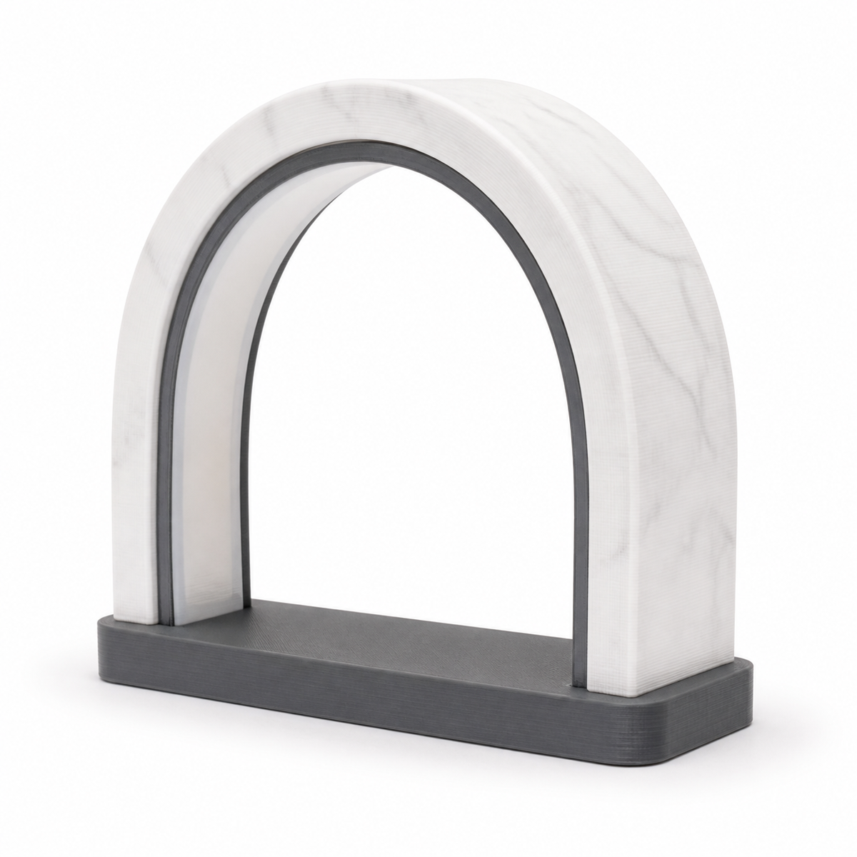 Arch-shaped LED decorative lamp in white marble look with dark grey inner frame and base on white background.