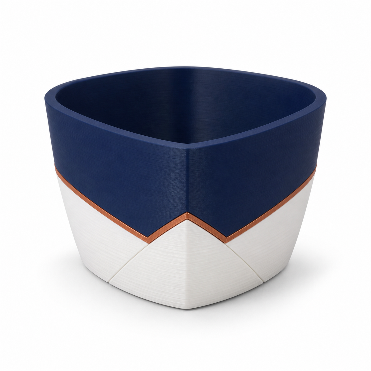 Product image by “plant night angle” on white background: planter; Basic shape: compact faceted pot with soft rounded opening; Design: dark blue upper half meets bright subfields in a deep angle; Colours: dark blue, off-white and copper.