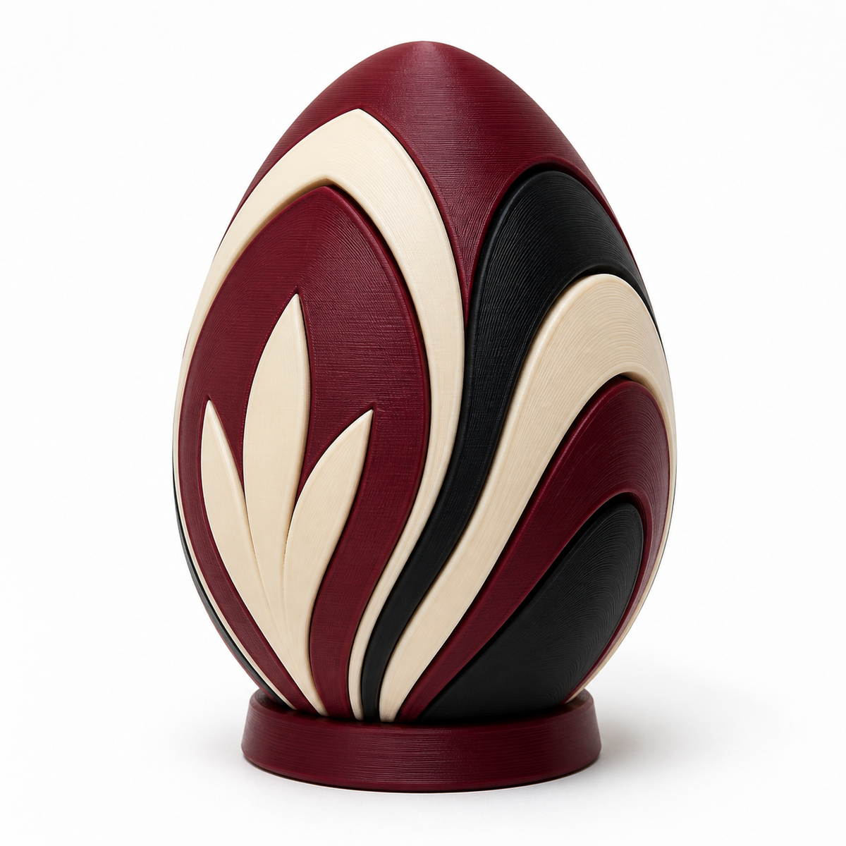 Product illustration of "Osterfigure Bordeaux leaf" on white background: Seasonal decorative figure; Basic shape: upright egg shape on a flat round base; Design: large-area curved leaf motif runs around the surface; Colours: Bordeaux, cream and black.